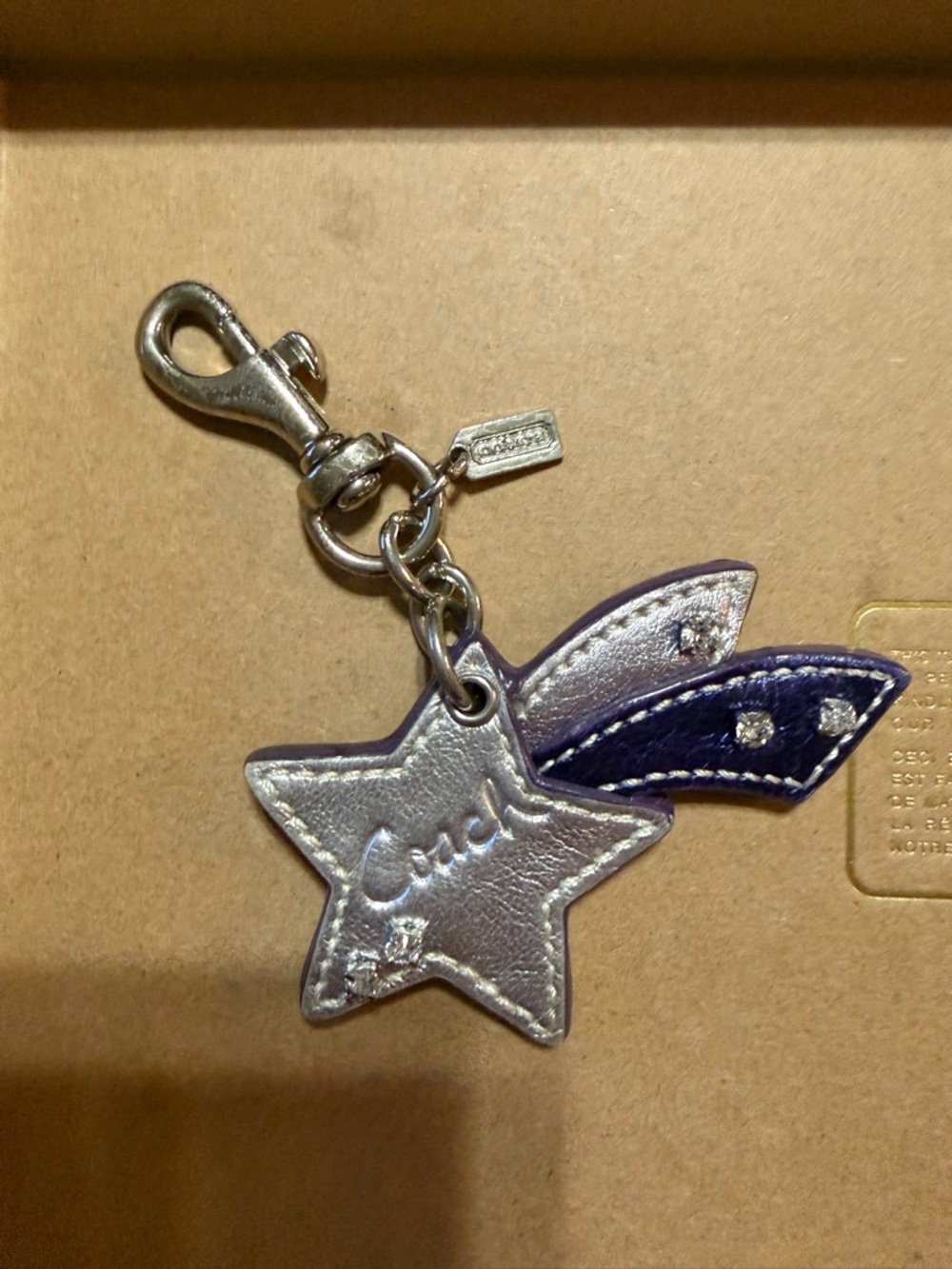 Coach Silver Star Keychain Charm with Navy Ribbon Accents